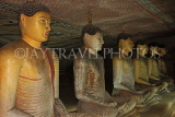 SRI LANKA, Dambulla Cave Temple (Golden Temple), row of seated Buddha statues in cave, SLK2863JPL