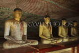 SRI LANKA, Dambulla Cave Temple (Golden Temple), row of seated Buddha statues in cave, SLK2865JPL