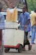 SRI LANKA, Kandy, Ice Cream vendor, pushing his trolly along lakeside, SLK3933JPL