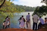 SRI LANKA, Kandy, Kandy Lake, people enjoying the view, SLK3685JPL