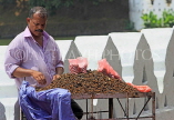 SRI LANKA, Kandy, Kandy lakeside, fruitseller, selling Velvet Tamarind (Gal Siyambala), SLK3957JPL