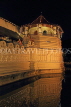 SRI LANKA, Kandy, Temple of the Tooth (Dalada Maligawa), and moat, night view, SLK3353JPL