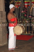 SRI LANKA, Kandy, Temple of the Tooth (Dalada Maligawa), drummer at temple ceremony, SLK3463JPL
