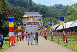 SRI LANKA, Kandy, Temple of the Tooth (Dalada Maligawa), visitors and Buddhist flags on walkway, SLK3345JPL