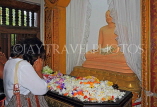 SRI LANKA, Kandy, Temple of the Tooth (Dalada Maligawa), worshipper and flower offerings, SLK3517JPL