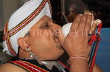 SRI LANKA, Kandy, cultural show, man blowing conch shell, SLK935JPL