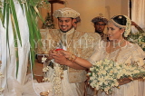 SRI LANKA, Kandy, traditional Kandyan Wedding, couple lighting lamps ritual, SLK3719JPL