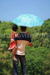 SRI LANKA, Kandy area, father and daughter, with umbrella under mid day sun, SLK2495JPL
