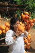 SRI LANKA, Kandy area, roadside stall selling King Coconut (Thambili), drinking fruit, SLK2554JPL