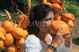 SRI LANKA, Kandy area, roadside stall selling King Coconut (Thambili), drinking fruit, SLK2557JPL