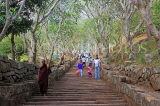 SRI LANKA, Mihintale temple site, prilgrims climbing the ancient granite stairway, SLK5393JPL
