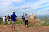 SRI LANKA, Mihintale temple site, visitors admring the view, towards Aradhana Gala, SLK5462JPL