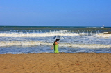 SRI LANKA, Negombo, beach, and tourist walking along seaside, SLK2457JPL