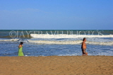 SRI LANKA, Negombo, beach, and tourists walking along seaside, SLK2456JPL