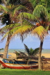 SRI LANKA, Negombo, beach, coconut trees and fishing boat (catamaran), SLK3551JPL