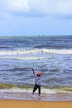 SRI LANKA, Negombo, beach, lone fisherman casting line out to sea, SLK3580JPL