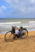 SRI LANKA, Negombo, beach, lone fisherman with his bicycle, SLK3579JPL