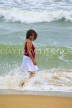 SRI LANKA, Negombo, beach and sea, Sri Lankan woman enjoying paddling, SLK2592JPL