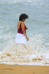 SRI LANKA, Negombo, beach and sea, Sri Lankan woman paddling, SLK2590JPL