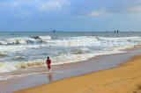 SRI LANKA, Negombo, beach and sea, boy running along beach, SLK3560JPL