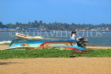 SRI LANKA, Negombo, beach and upturned boat, SLK6132JPL