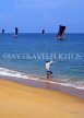 SRI LANKA, Negombo, catamarans at sea and man fishing from shore, SLK2060JPL