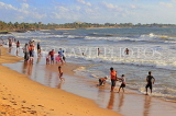 SRI LANKA, Negombo, evening by the seaside, people enjoying paddling, SLK5934JPL