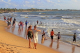 SRI LANKA, Negombo, evening by the seaside, people enjoying paddling, SLK5935JPL