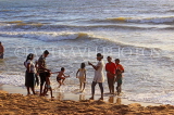 SRI LANKA, Negombo, evening by the seaside, people enjoying paddling, SLK5940JPL