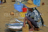 SRI LANKA, Negombo, fish market scene, fishwife with basket of fish, SLK2032JPL
