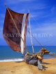 SRI LANKA, Negombo, fishermen pushing out catamaran (traditional fishing boat), SLK1641JPL