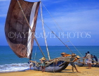 SRI LANKA, Negombo, fishermen pushing out catamaran (traditional fishing boat), SLK1953JPL