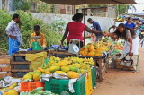 SRI LANKA, Negombo, market, fruit and vegetable market, Papaya stall, vendor and shopper, SK2723JPL