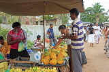 SRI LANKA, Negombo, market, fruit and vegetable market, Papaya stall, vendor and shoppers, SK2730JPL