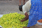 SRI LANKA, Negombo, market, fruit and vegetable market, vendor arranging chillies, SLK6200JPL