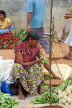 SRI LANKA, Negombo, market, fruit and vegetable market, vendor with Okra and scales, SK2713JPL