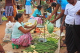 SRI LANKA, Negombo, market, fruit and vegetable market, vendor with scales and shopper, SLK2702JPL