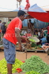SRI LANKA, Negombo, market scene, fruit and vegetable market, vendor with scales, SLK2655JPL