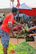 SRI LANKA, Negombo, market scene, fruit and vegetable market, vendor with scales, SLK2659JPL