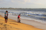 SRI LANKA, Negombo, people walking by beach, SLK3583JPL