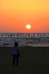 SRI LANKA, Negombo, sea, sunset, woman watching sunset, SLK3599JPL