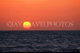 SRI LANKA, Negombo, sea and sun setting over horizon, SLK3523JPL