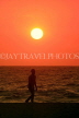 SRI LANKA, Negombo, sea and sunset, man walking along beach, SLK3610JPL