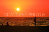 SRI LANKA, Negombo, sea and sunset, people walking along beach, SLK3606JPL
