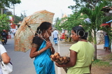 SRI LANKA, Negombo, street scene with two Sri Lankan women chatting, SLK2597JPL
