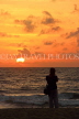 SRI LANKA, Negombo, sunset, sea, and woman on beach, SLK6040JPL