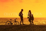 SRI LANKA, Negombo, sunset, sea, people and bicycle on beach, SLK6042JPL