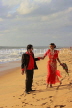 SRI LANKA, Negombo, wedding couple walking along beach, SLK3531JPL