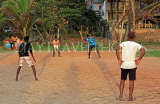 SRI LANKA, Negombo, young people playing cricket on beach, SLK6355JPL