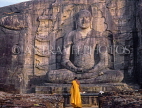 SRI LANKA, Polonnaruwa, Gal Viahre (stone temple), granite carved seated Buddha, and monk, SLK1622JPL